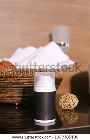 Natural skincare cosmetics, creams and oils on bath background. Plant-based beauty products.