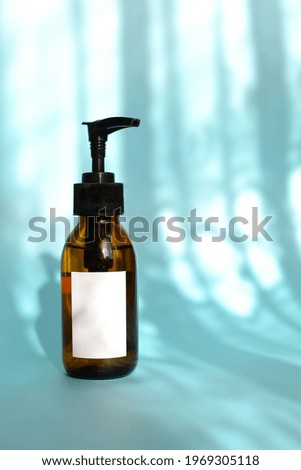 Natural skincare cosmetics, creams and oils on blue background. Plant-based beauty products.