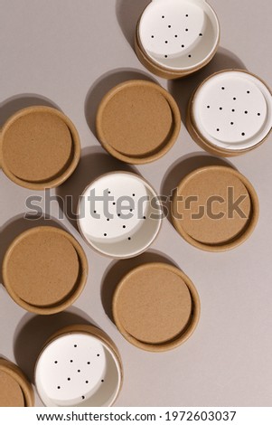 Recyclable paper tube with paper cap, cardboard container for packaging isolated on white background with copyspace, mockup. Recyclable packaging and zero waste concept