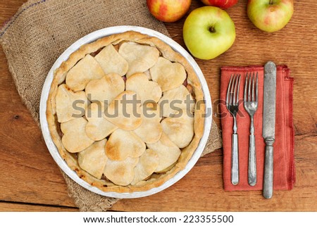 Apple pie with heart shaped crust topping, shot from above.