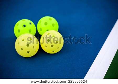 Pickleball balls on a pickle ball court