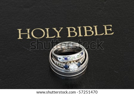 stock photo Wedding rings on bible