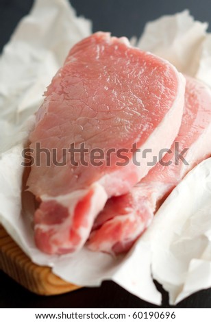 Raw pork steaks on the cutting board,shallow focus