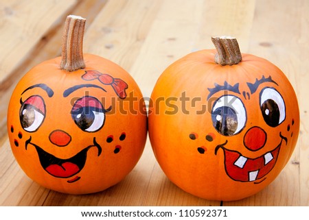 Painted pumpkins on a wooden table