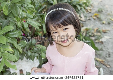 Thai little cute girl in action - tradition dress