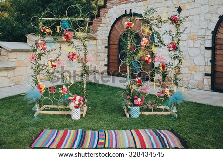 Area decorated wedding flower arrangements, stained carpet and the hoop with colored thread