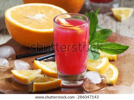 Freshly squeezed juice from red orange with pulp, selective focus