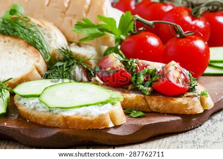 Two types of sandwiches: tomato and cucumber, selective focus