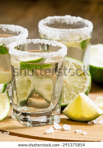 Silver Mexican tequila with lime and salt, selective focus