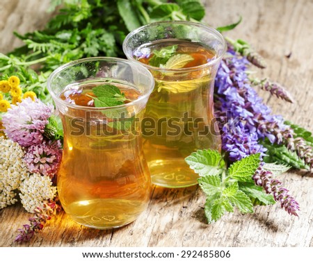 Green hot tea with herbs in Islamic glasses, selective focus