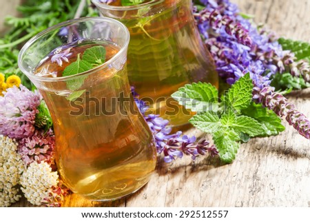 Green hot tea with herbs in Islamic glasses, selective focus