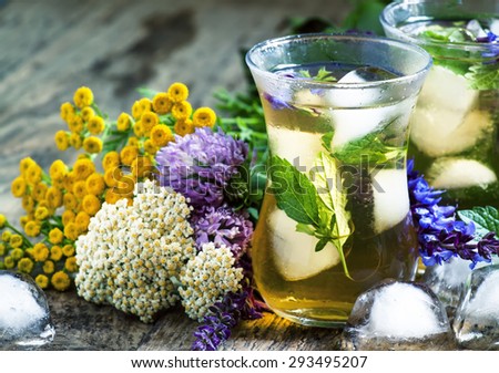 Herbal flower iced tea with ice in Islamic glasses, toned, selective focus