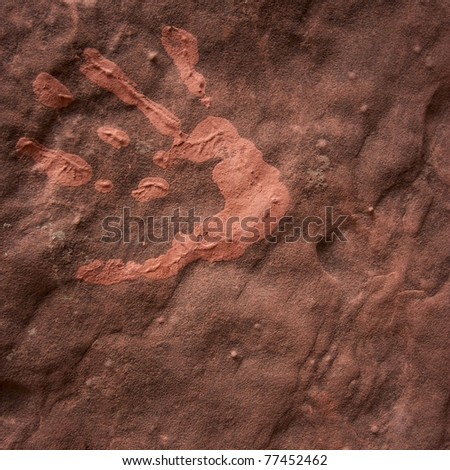 A mud hand-print on the sandstone rock walls of Zion National Park, Utah, USA