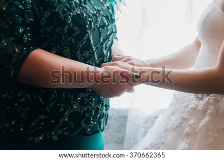 bride with mother wedding hand happy together