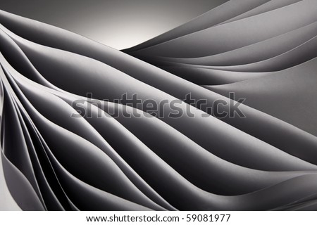 Abstract waved ocean-like pages on the grey background isolated in studio