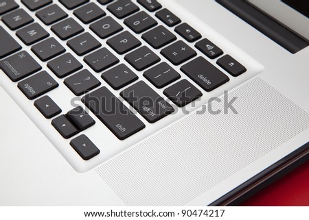 Computer black keyboard on the red table