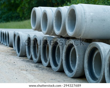 concret pipe stacked sewage water system aligned