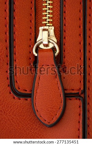 zipper on a leather bag