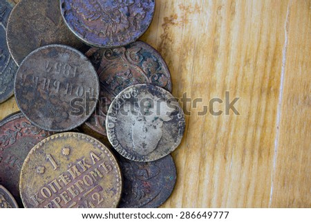 a bunch of old copper and silver coins on board