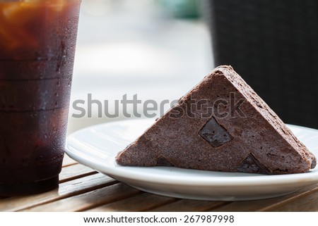 brownies cake ready to eat with coffee cup  on table top