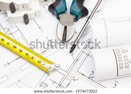 Work tools, electric fuse and diagrams of housing plan with electrical installation. Building home concept