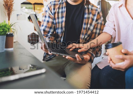 A group of business people using laptop computer while working together