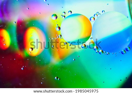 A closeup of bubbles under bright colorful lights - perfect for wallpapers