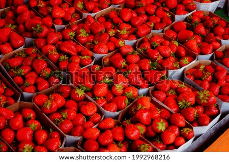 Strawberries on a market stall  Beautiful red and fresh from local production  \
Weekly market in Frankfurt
