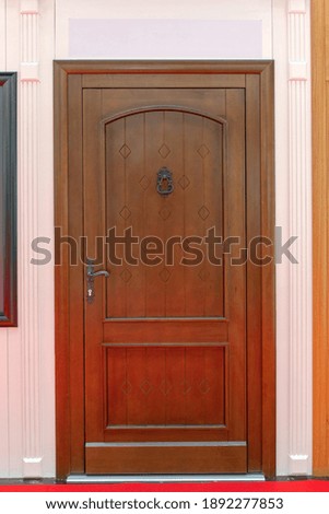 Closed Wooden Door at Classic Home Entrance