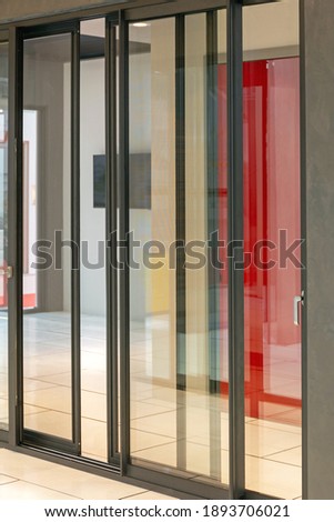 Aluminium Black Sliding Doors in Home Corridor