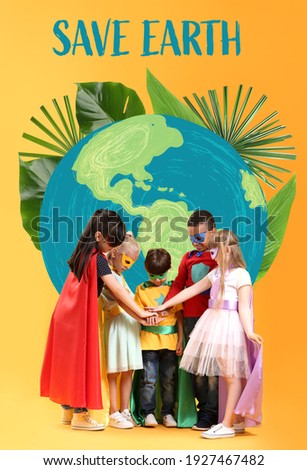 Cute little children dressed as superheroes near drawing of planet on color background. Earth Day celebration