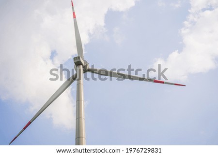 Wind power plant. green meadow with Wind turbines generating electricity