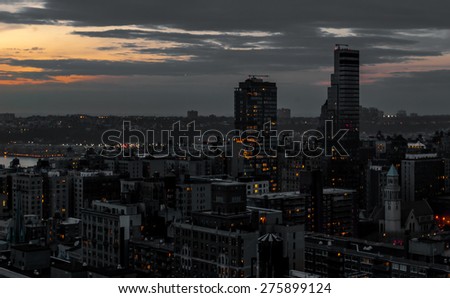 Black light city, black and white and grey city with bright colored lights. Modern city skyline.