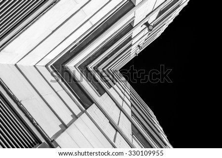 Urban Geometry, looking up to building. Modern architecture black and white, concrete and glass.  Abstract architectural design. Inspirational, artistic image BW. Artistic image and point of view.
