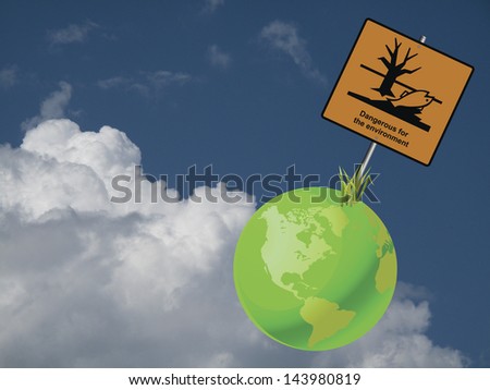 Green earth dangerous to the environment sign against a cloudy blue sky