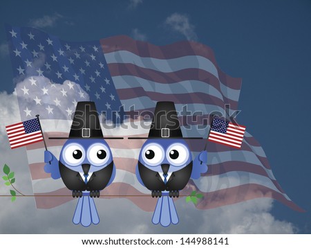 Thanksgiving flag waving birds sat on a tree branch against a cloudy blue sky