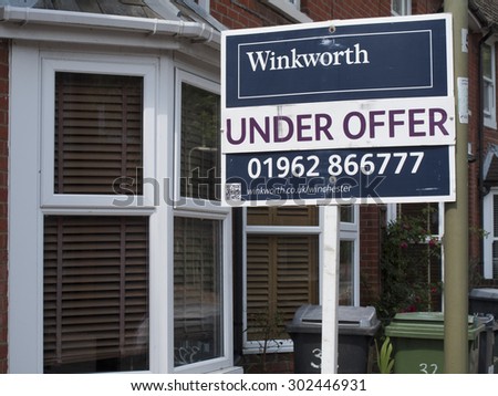 Winchester, Hampshire, England - July 31, 2015: estate agent residential house for sale sign