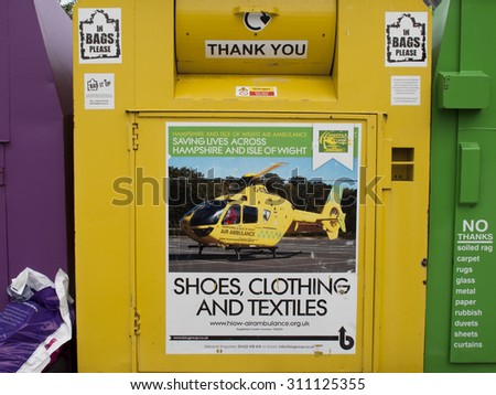 Andover, River Way, Hampshire, England - August 29, 2015: Air ambulance clothing charity recycling collection bin Tesco Extra Superstore