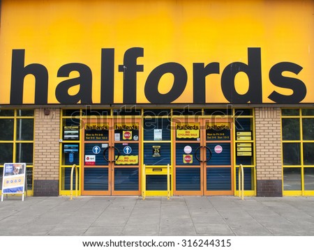 Andover, Retail Park, Hampshire, England - September 7, 2015: Halfords Group plc store, UK retailer of car parts, car enhancement, camping, touring and bicycles, founded in 1892