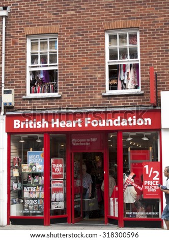 Winchester High Street, Hampshire, England - July 31, 2015: British Heart Foundation charity shop, UK charity campaigns aimed to prevent heart diseases