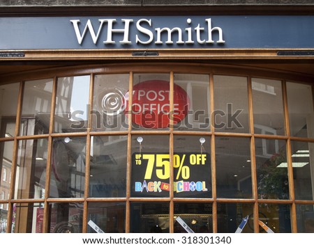 Winchester, High Street, Hampshire, England - July 31, 2015 W H Smith shop window poster advertising reductions on back to school