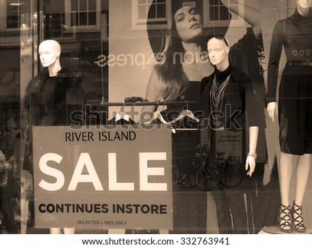 Newbury, High Street, Berkshire, England - August 21, 2015: River Island ladies and men clothing retailer shop window display, company founded in 1948