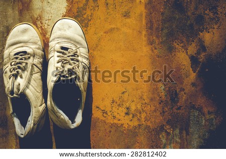 old shoes.old background. dirty shoes. grunge