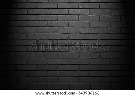 Light on black brick wall. Brick wall background