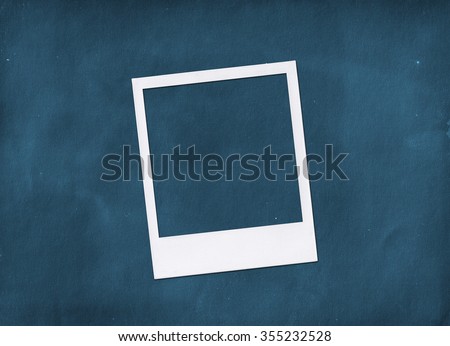 Instant photo frame on blue. Polaroid photo frame