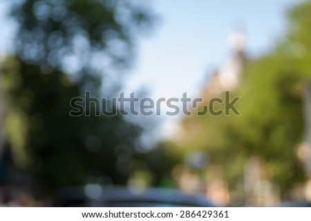 Blurred background photo.Cityscape bokeh. Defocused abstract city.Background out of focus.Can use as wallpaper, design. Summer blurry city backdrop.Travel out of focus photos. Fairy defocused photos.