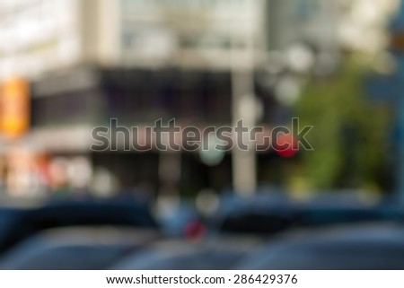 Blurred background photo.Cityscape bokeh. Defocused abstract city.Background out of focus.Can use as wallpaper, design. Summer blurry city backdrop.Travel out of focus photos. Fairy defocused photos.