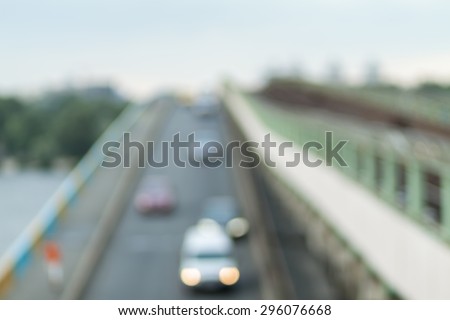 Blurred background photo.Cityscape bokeh. Defocused abstract city.Background out of focus.Can use as wallpaper, design. Summer blurry city backdrop.Fairy defocused photos.