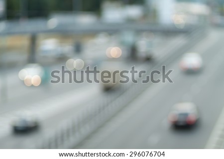 Blurred background photo.Cityscape bokeh. Defocused abstract city.Background out of focus.Can use as wallpaper, design. Summer blurry city backdrop.Fairy defocused photos.