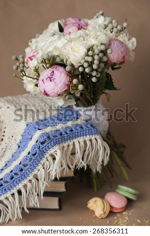 Beautiful bright wedding bouquet of hydrangea, peonies to knit scarf